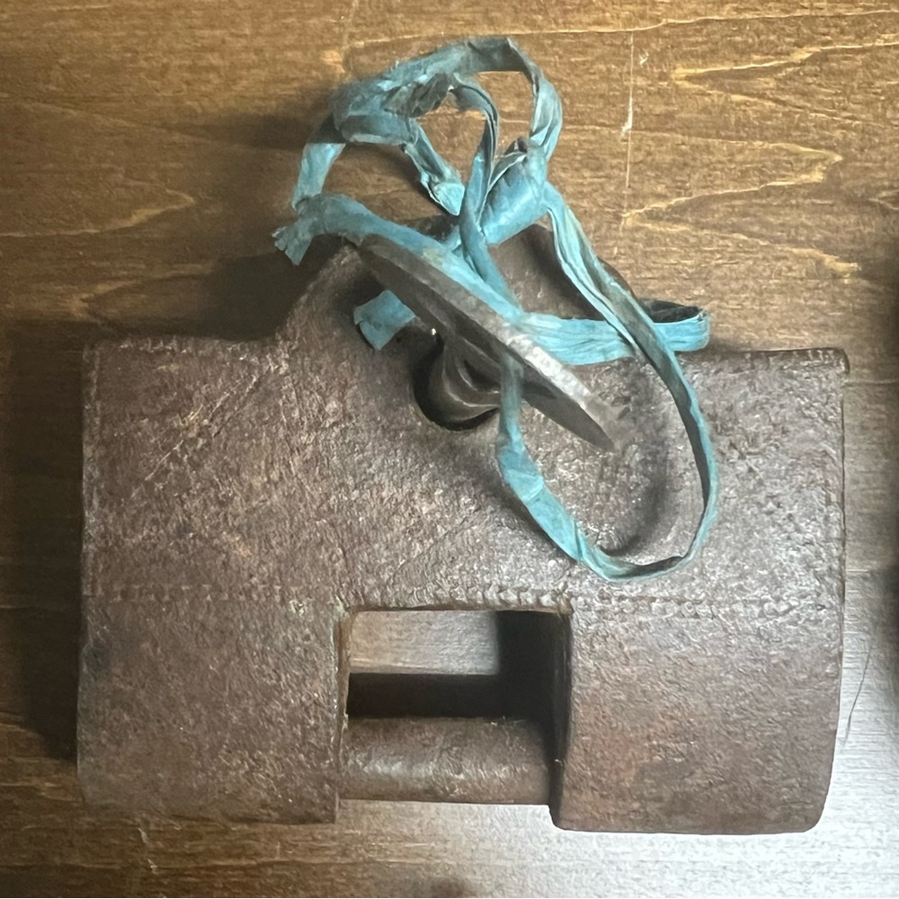 Vintage Brown Metal Lock with Blue Ribbon